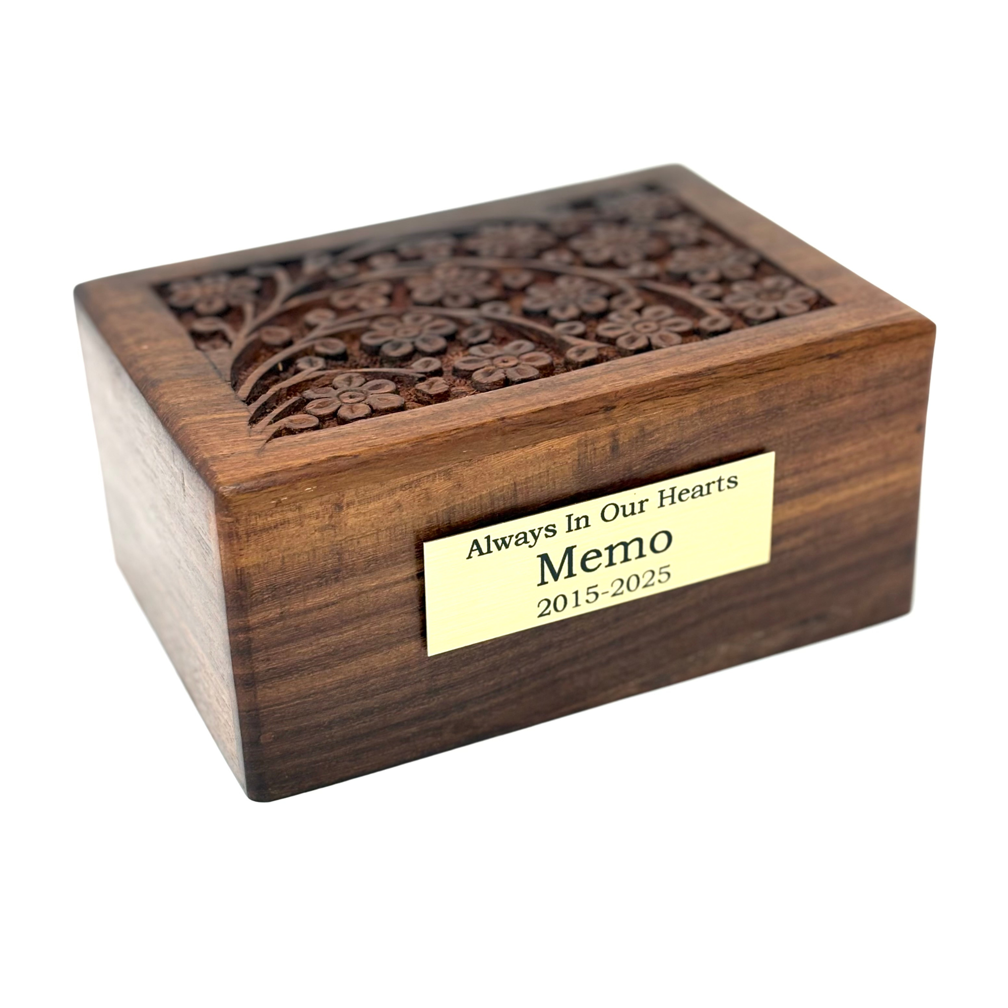 A wooden pet urn with a hand-carved tree of life design on the lid, featuring a brass name plate.